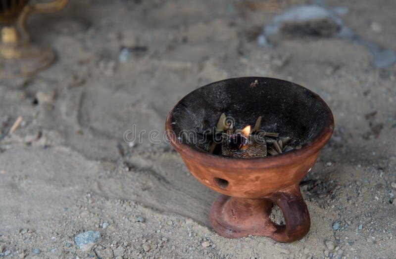 Religious censer with burning candle stock images Religious censer with burning candle stock images