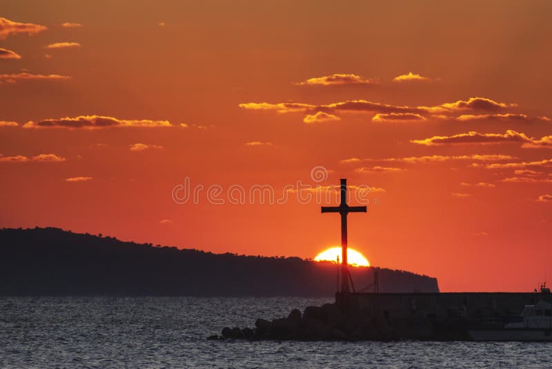 Religious cross and rising sun behind it. Resurrection of the lord, easter, nativity of Jesus Christ. Nessebar, Bulgaria. Christian cross and rising sun behind royalty free stock image Religious cross and rising sun behind it. Resurrection of the lord, easter, nativity of Jesus Christ. Nessebar, Bulgaria. Christian cross and rising sun behind royalty free stock image