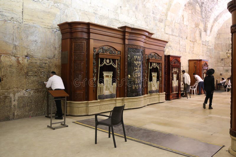 Religious Jews pray by the Western Wall inside of the Western Wall Tunnel at the Old City of Jerusalem. royalty free stock images Religious Jews pray by the Western Wall inside of the Western Wall Tunnel at the Old City of Jerusalem. royalty free stock images