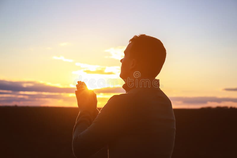 Religious Man Praying Outdoors at Sunset Stock Photo Image of