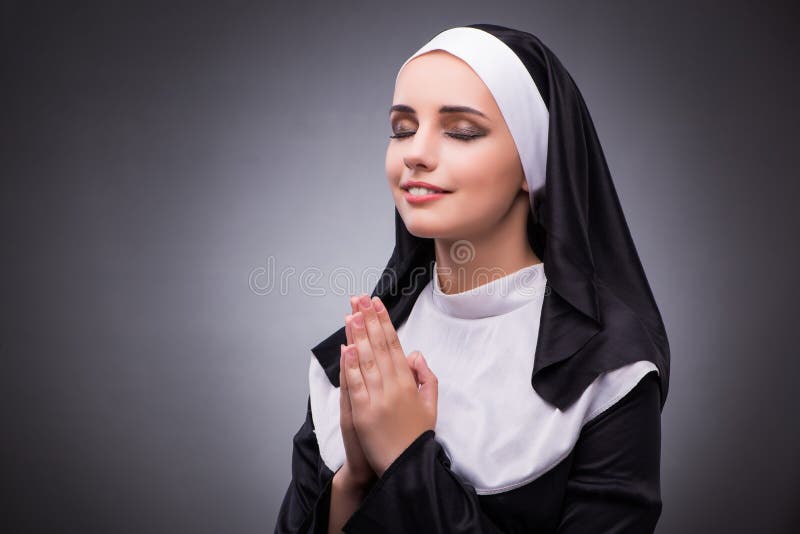 religious-nun-religion-concept-against-dark-background-77735537.jpg