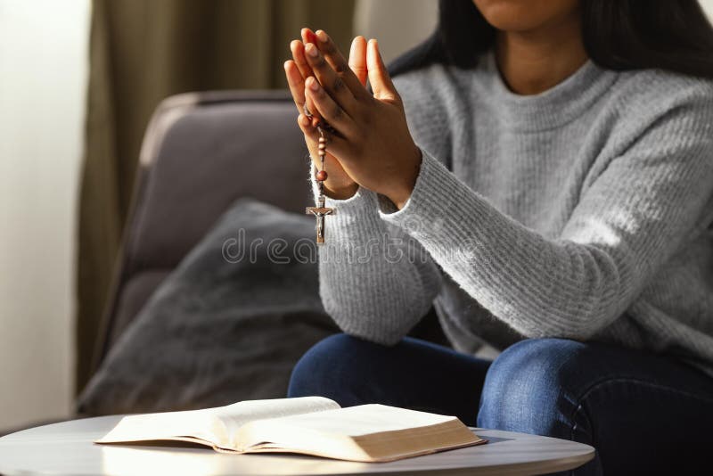 Religious Woman Praying with Rosary Beads. High Quality Photo Stock