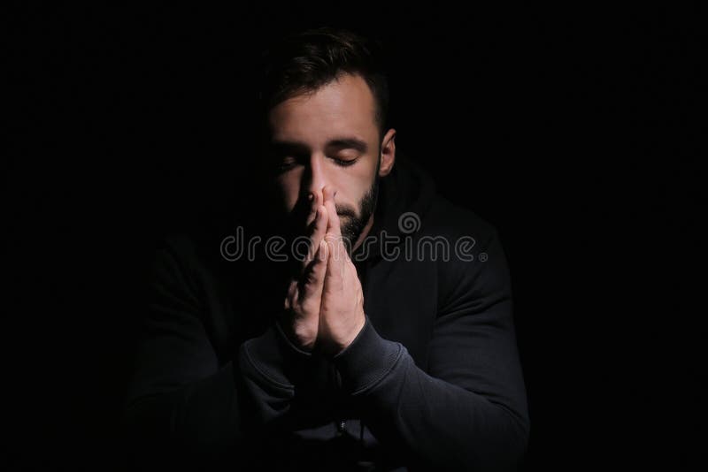 Religious Young Man Praying To God on Black Background Stock Image - Image  of black, holy: 151268315