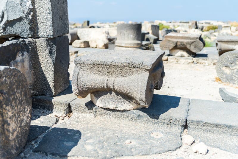 The remains of the column in the ruins of the Greek - Roman city of the 3rd century BC - the 8th century AD Hippus - Susita on the stock image The remains of the column in the ruins of the Greek - Roman city of the 3rd century BC - the 8th century AD Hippus - Susita on the stock image