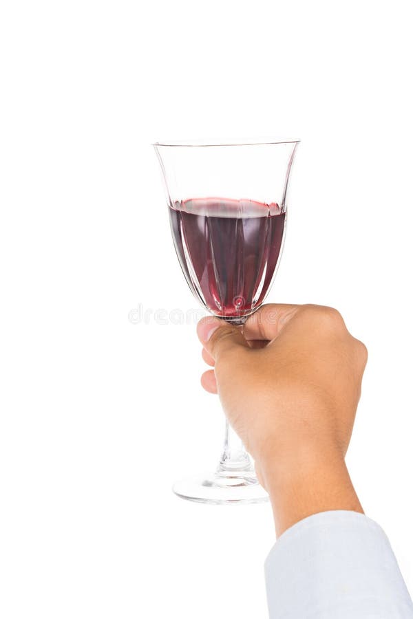 Remettez juger le vin rouge en verre cristal prêt à griller images stock Remettez juger le vin rouge en verre cristal prêt à griller images stock