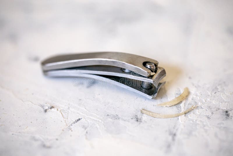 Remnants of a Human Nails Cut Off Using a Nail Clipper. Stock Image