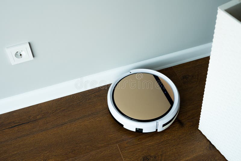 The Remotecontrolled Vacuum Cleaner Works Along the Floor Along the