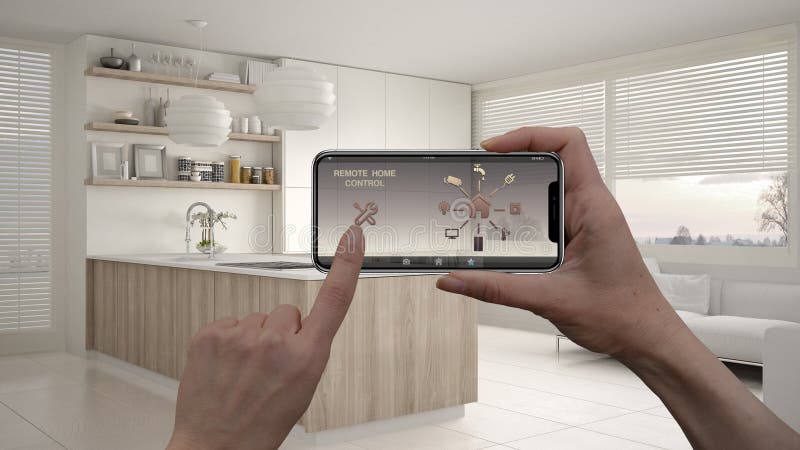 Remote home control system on a digital smart phone tablet. Device with app icons. Interior of modern kitchen with shelves and cab royalty free stock images Remote home control system on a digital smart phone tablet. Device with app icons. Interior of modern kitchen with shelves and cab royalty free stock images