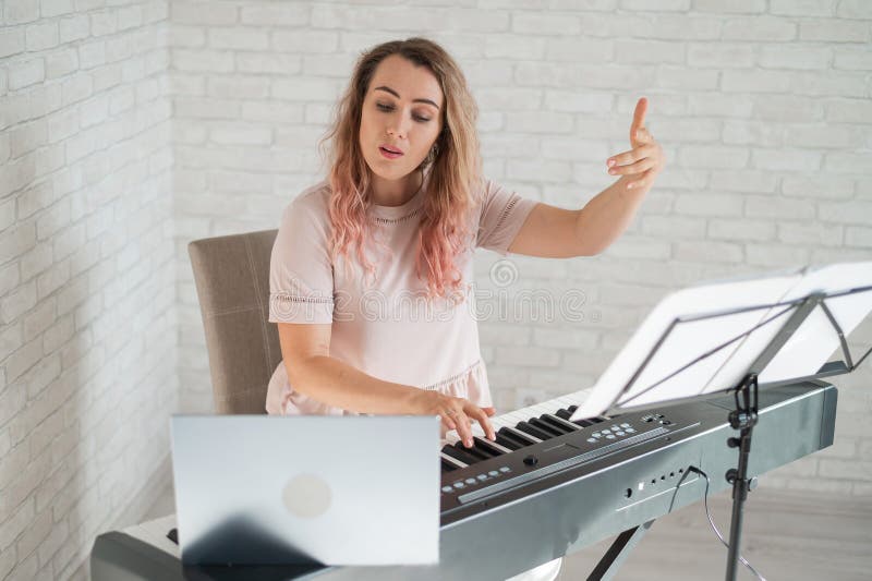 Remote Music Lessons. a Singing Teacher Records the Lesson on a Laptop