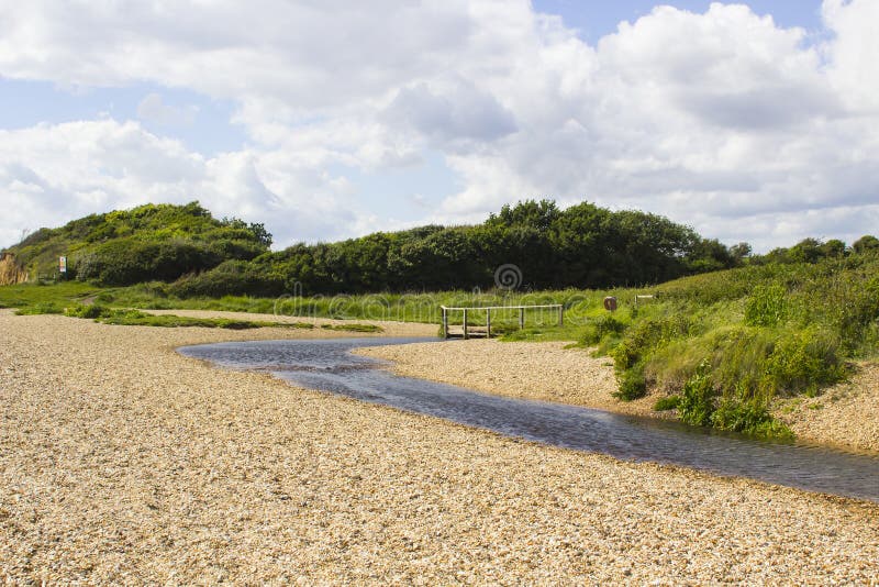 A remote wooden footbridge at the end of the Hook Lane bridle path near Titchfield Common England stock photo