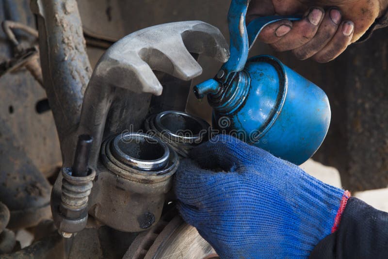 Removing Brake Caliper stock photo. Image of land, people 44692066