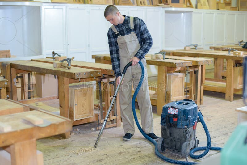 Removing dust from floor stock photo. Image of manual 93833468