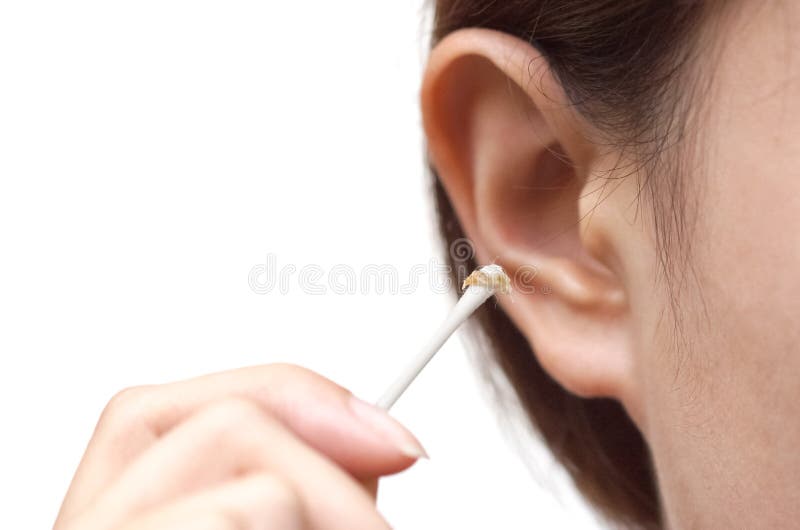Removing ear wax using a cotton bud stock photography Removing ear wax using a cotton bud stock photography