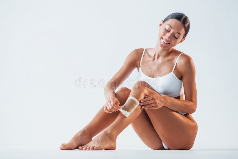 Young woman removes panties Stock Photo