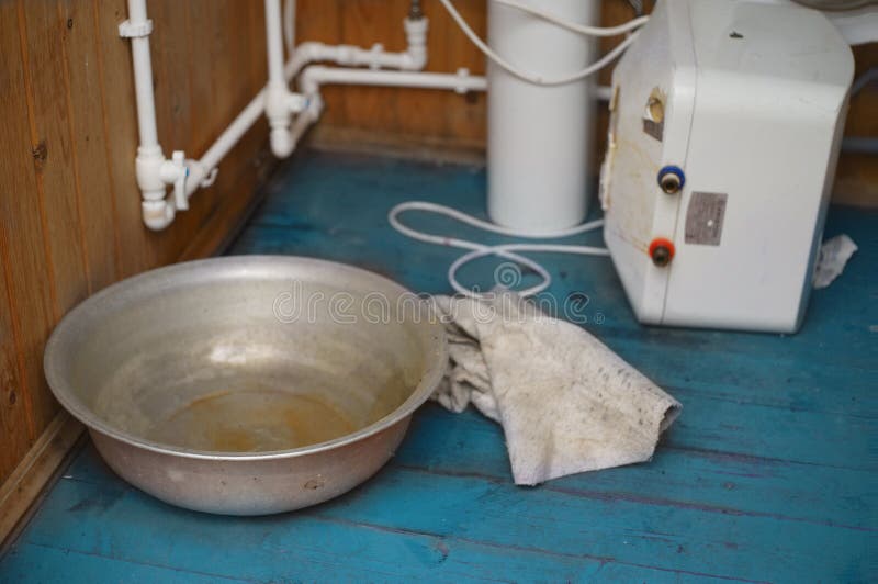 Water leaking in bathroom stock image. Image of pipes 146117181