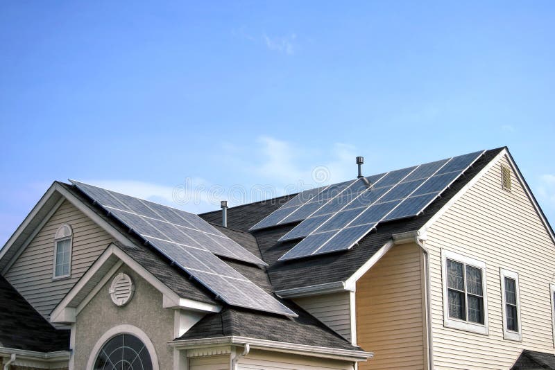Renewable Green Energy Solar Panels on House Roof royalty free stock photo
