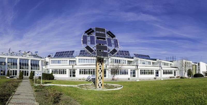 Panorama with The Transylvania Faculty - on the Hill in Brasov. It has an entire solar panels system to produce green energy for almost all the building. System consists of series of solar panels mounted on the roof of the building and having no objects to shadow the system. It is south oriented. Panorama with The Transylvania Faculty - on the Hill in Brasov. It has an entire solar panels system to produce green energy for almost all the building. System consists of series of solar panels mounted on the roof of the building and having no objects to shadow the system. It is south oriented.