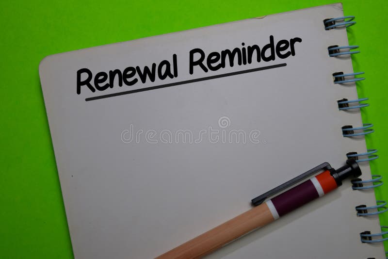 Renewal Reminder write on a book isolated on Office Desk royalty free stock image