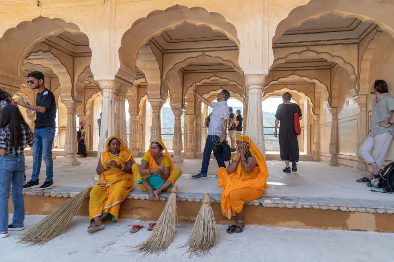 Cleaners in the main courtyard in the Amber, Fort Amer , Rajasthan, India. A narrow 4WD road leads up to the entrance gate, known as the Suraj Pol (Sun Gate) of the fort. It is now considered much more ethical for tourists to take jeep rides up to the fort, instead of riding the elephants. Amer Fort or Amber Fort is a fort located in Amer, Rajasthan, India. Amer is a town with an area of 4 square kilometres (1.5 sq mi) located 11 kilometres (6.8 mi) from Jaipur, the capital of Rajasthan. Located high on a hill, it is the principal tourist attraction in Jaipur. Amer Fort is known for its artistic style elements. With its large ramparts and series of gates and cobbled paths, the fort overlooks Maota Lake which is the main source of water for the Amer Palace. Cleaners in the main courtyard in the Amber, Fort Amer , Rajasthan, India. A narrow 4WD road leads up to the entrance gate, known as the Suraj Pol (Sun Gate) of the fort. It is now considered much more ethical for tourists to take jeep rides up to the fort, instead of riding the elephants. Amer Fort or Amber Fort is a fort located in Amer, Rajasthan, India. Amer is a town with an area of 4 square kilometres (1.5 sq mi) located 11 kilometres (6.8 mi) from Jaipur, the capital of Rajasthan. Located high on a hill, it is the principal tourist attraction in Jaipur. Amer Fort is known for its artistic style elements. With its large ramparts and series of gates and cobbled paths, the fort overlooks Maota Lake which is the main source of water for the Amer Palace.
