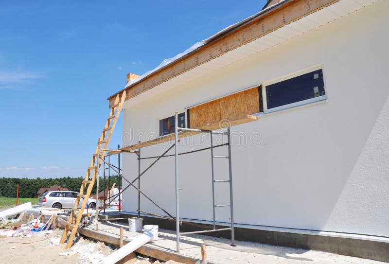 Renovation house wall with plastering, foundation insulation, stucco, repair eaves. Renovation house wall with plastering, foundation insulation, stucco, repair eaves.