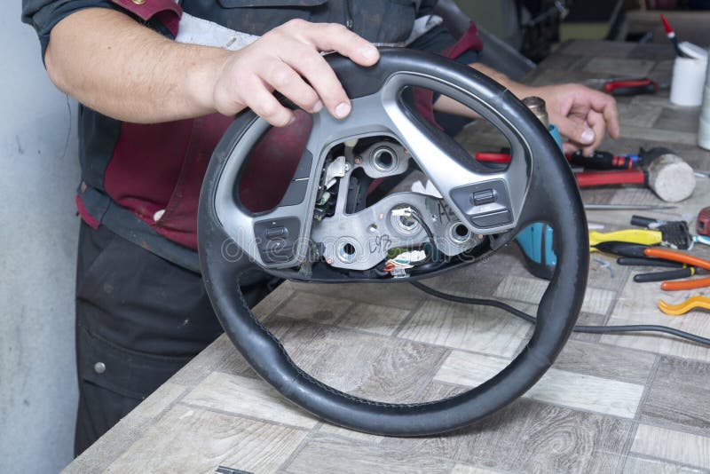 Repair of Car Seats and Steering Wheels. Car Interior Repairs Stock