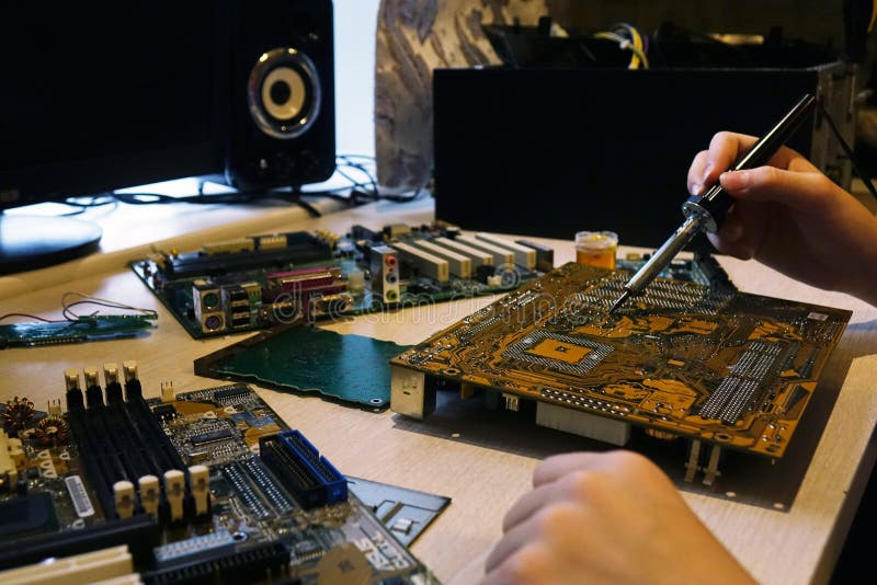 Repair of Electronic Devices and Printed Circuit Boards. Stock Photo