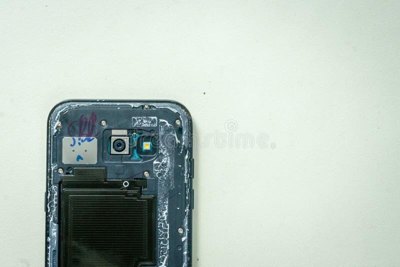 Repair faulty mobile phone on desk. concept of computer hardware, mobile phone, electronic, repairing royalty free stock image