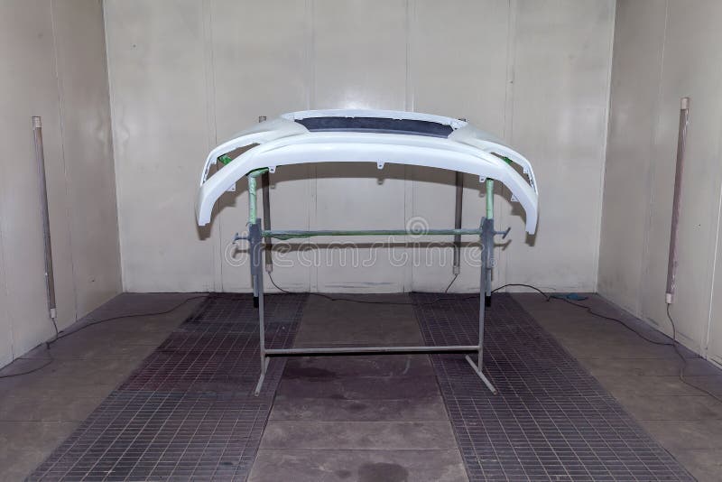 Repair of the Rear Bumper of a White Car after an Accident with the