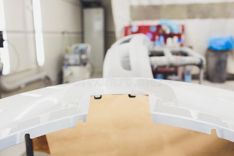 Repair of the Rear Bumper of a White Car after an Accident with the