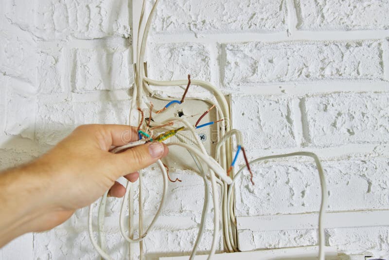Repair and Replacement of Electrical Cables in the House Stock Image