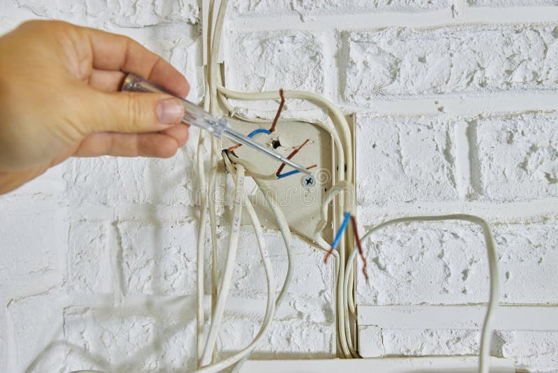 Repair and Replacement of Electrical Cables in the House Stock Image