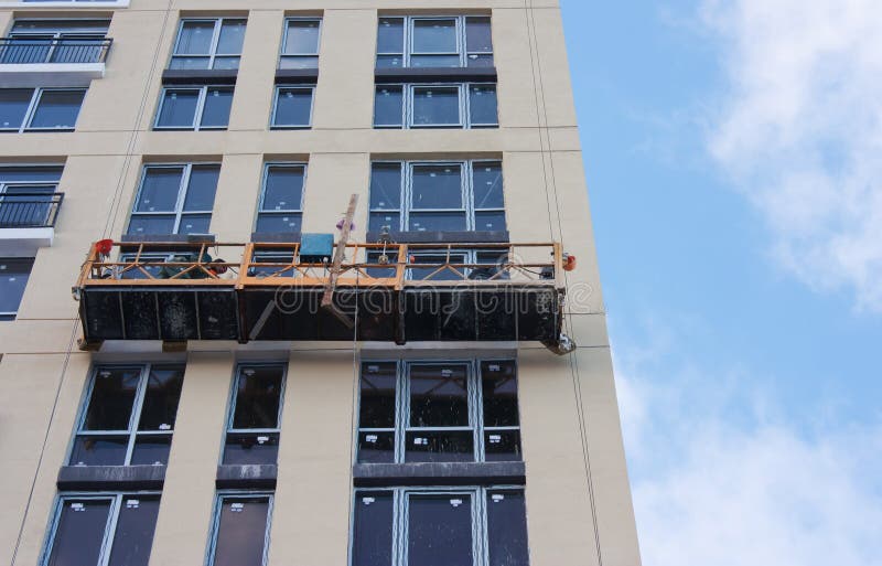Repair and restoration of a facade of a high building. royalty free stock images Repair and restoration of a facade of a high building. royalty free stock images