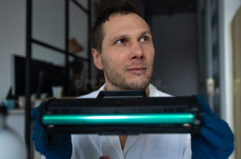 Hands Repairing Laser Toner Cartridge. Worker Laser Printer on a
