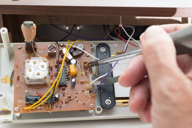 Repairing clock radio stock image. Image of metal, modern 43948545
