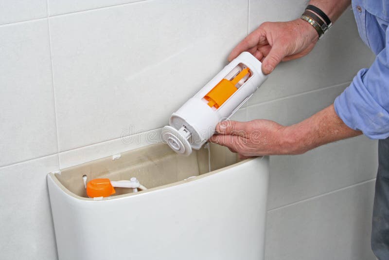 Repairing a toilet cistern stock photo. Image of cistern 73582210