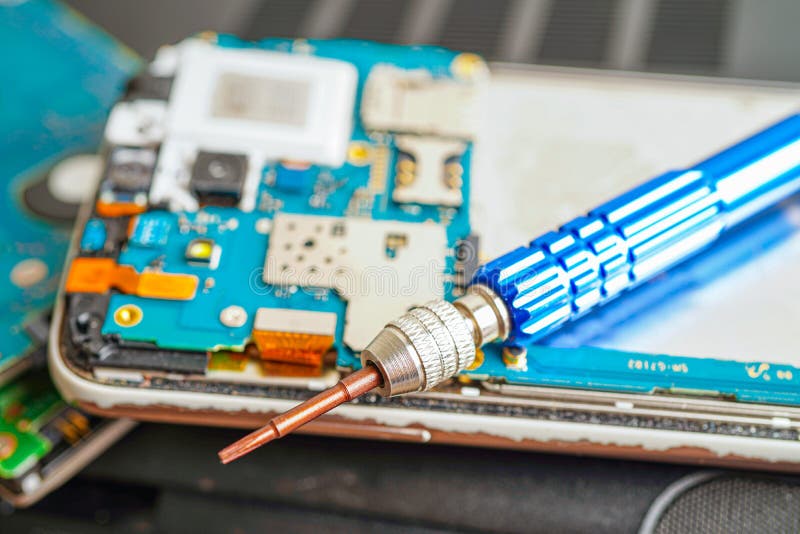 Repairing and upgrade mobile phone, electronic, computer hardware and technology concept royalty free stock photography