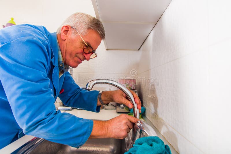 Repairman Fixing the Kitchen Tap Stock Photo Image of fixing