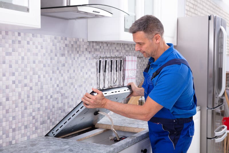 Repairman Installing Induction Stove Stock Image Image of equipment