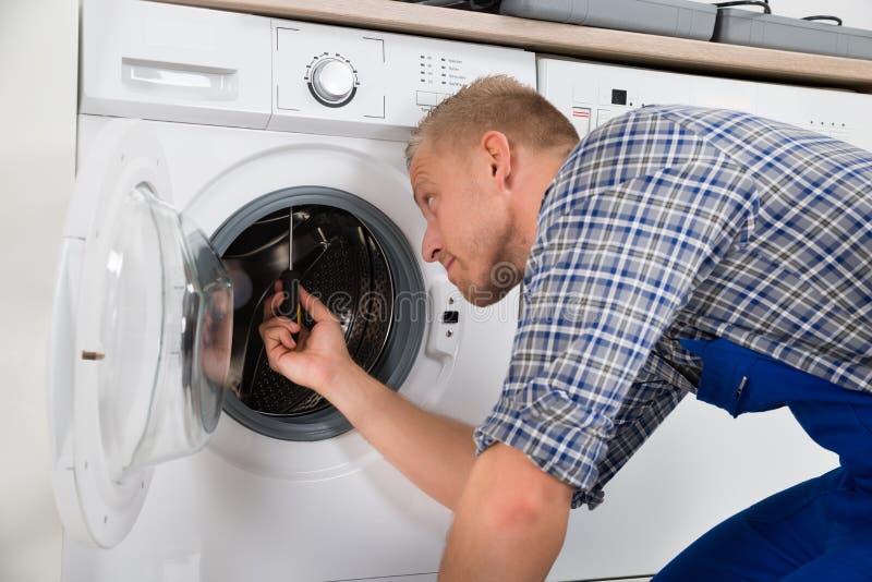 Repairman Repairing Washer