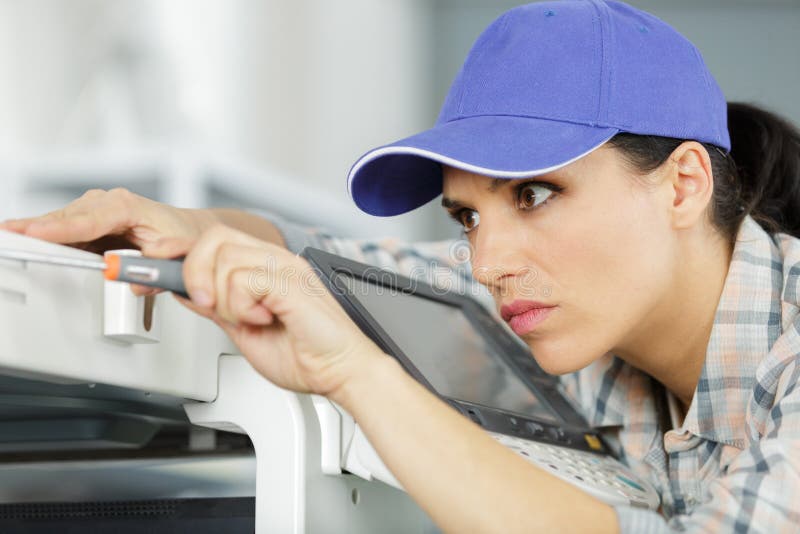 woman repairman repairing broken printer fax machine worker. woman repairman repairing broken printer fax machine worker