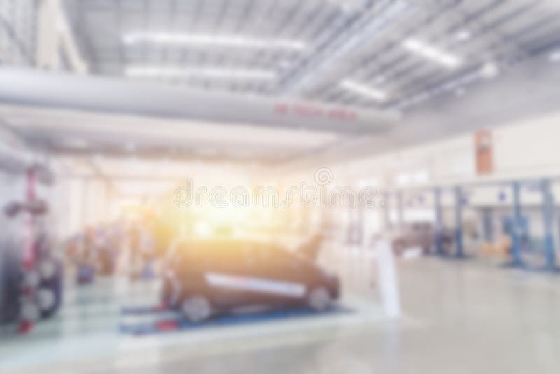 Reparationen för bilen för service för bilen för suddighetsgaragemedlet shoppar royaltyfri fotografi Reparationen för bilen för service för bilen för suddighetsgaragemedlet shoppar royaltyfri fotografi