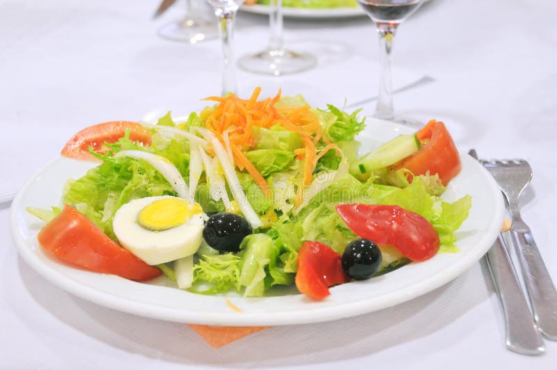 Close-up of plate with salad appetizer meal. Close-up of plate with salad appetizer meal