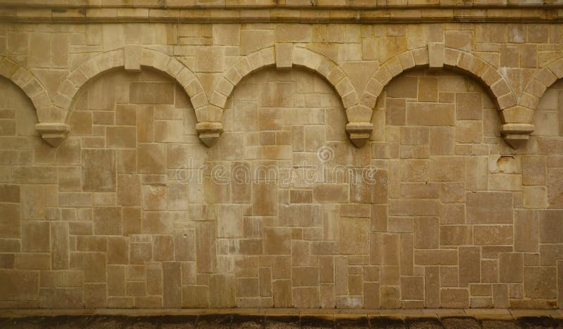 Repeating columns on a block wall in a medieval church