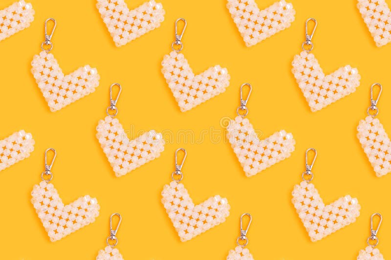 Repetitive pattern made of keychain in a heart shape. royalty free stock photography