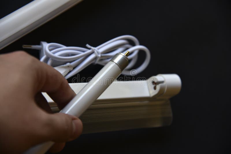 Replacement of Fluorescent Lamps in the Lamp on a Black Background