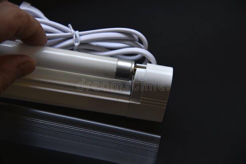 Replacement of Fluorescent Lamps in the Lamp on a Black Background