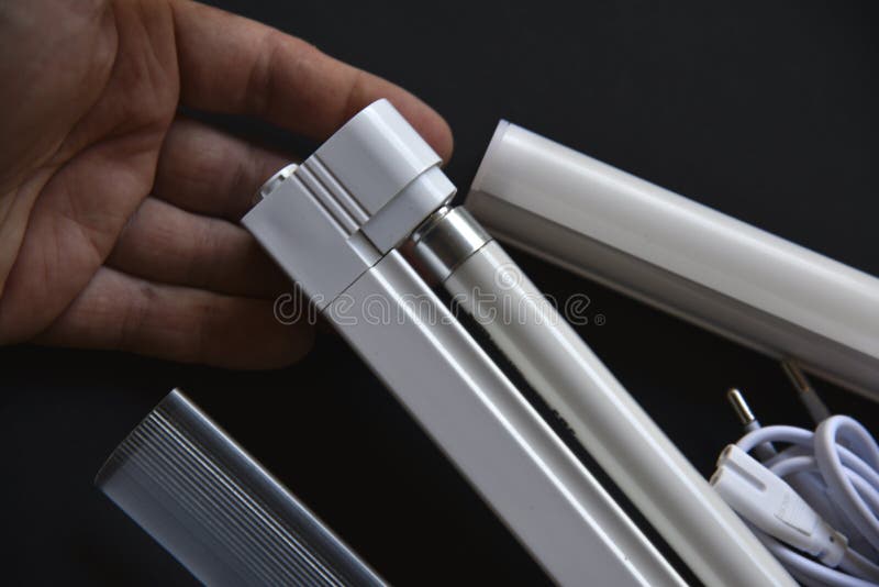 Replacement of Fluorescent Lamps in the Lamp on a Black Background
