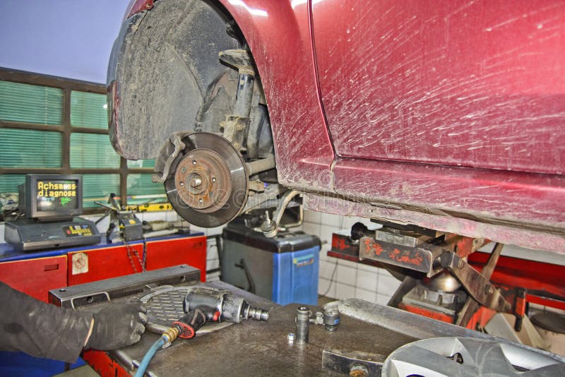 Replacing the car bearing stock image. Image of object 132076271