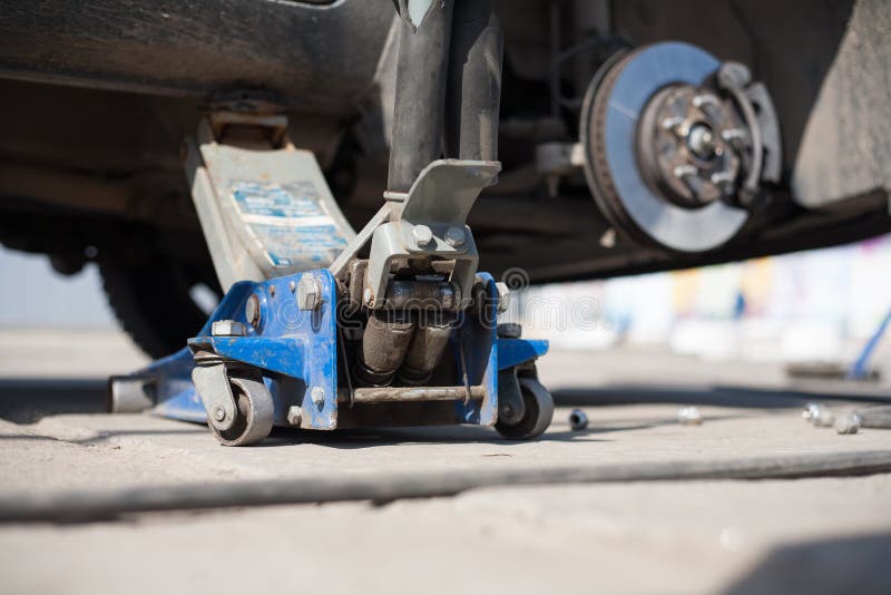 Jacked Up Car Wheel Replacement Stock Image Image of wheel, mechanic