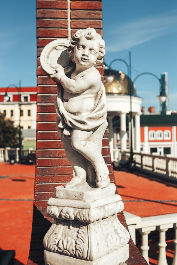 Beautiful stone statue of a boy throwing a disc royalty free stock images